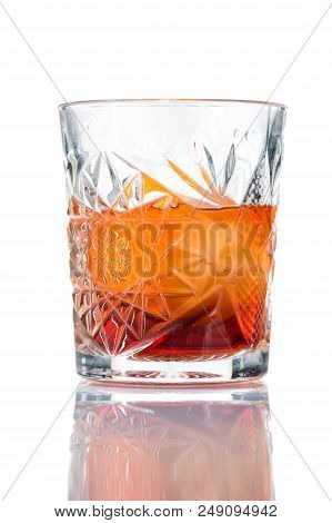 Alcohol Cocktail Negroni With Orange Ice Ball And Whiskey, Close-up, Isolated On White Background