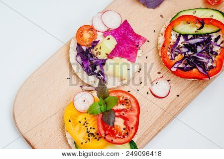 Open Sandwiches Of Rice Cakes With Cream Cheese , Vegetables, Healthy Breakfast
