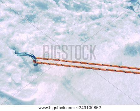 Rope On A Camp Tent, Detail Of Anchored Tent In Snowy Ground Within Extreme Mountain Trail.