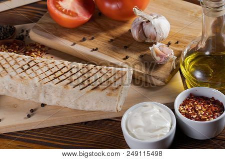 Shaurma, Shaurma Doner, Meat With Vegetables In A Bread Cake, On A Light Stone Or Concrete Backgroun