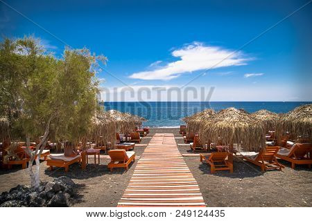 Permissa black sand beach in Santorini. Greece. 