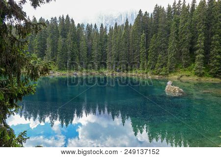 Lake Carezza With Reflection Of Mountains In The Dolomites