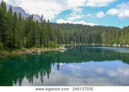 Lake Carezza With Reflection Of Mountains In The Dolomites