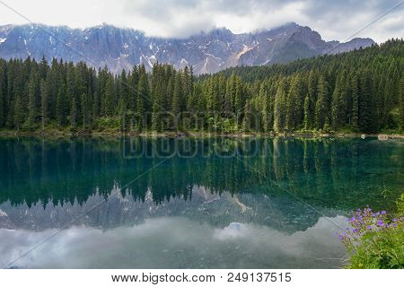 Lake Carezza With Reflection Of Mountains In The Dolomites