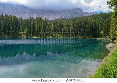 Lake Carezza With Reflection Of Mountains In The Dolomites