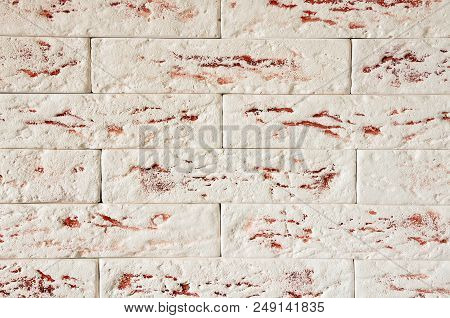 A Fragment Of The Wall Made Of Plaster Decorative Bricks, Without Seams.