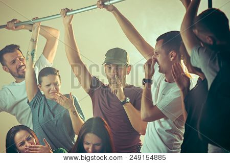 Smell Of Sweat. Sweaty Armpits. Man In Bus Or Public Transport. The Unhappy People Near Man. Hyperhi
