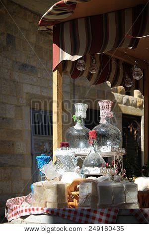 A Cart With Traditional Glass Water Pitchers Covered With Crochet Lids In The Souk Of Douma, Lebanon