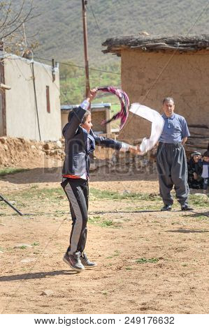 Lorestan Province, Iran - April 1, 2018: Iranian Boy With Handkerchief Dansing Lurish Dances On Wedd