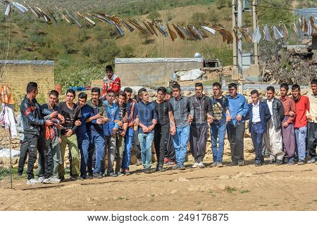 Lorestan Province, Iran - April 1, 2018: Iranian Men Dansing Lurish Cupi Dances On Wedding Ceremony 
