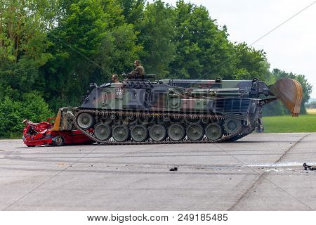 Feldkirchen / Germany - June 9, 2018: German Tank Dozer Dachs Crashes A Red Car On Day Of The Bundes
