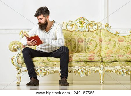 Self Improvement Concept. Macho On Concentrated Face Reading Book. Guy Reading Book With Attention. 
