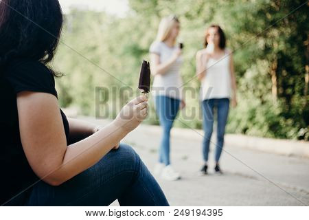 Unhealthy Lifestyle, Excessive Weight, Overeating, Obesity. Overweight Woman Sit In The Street Eatin