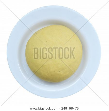 Round Raw Dough With Curry For Homemade Dumplings On A White Plate Isolated On A White Background