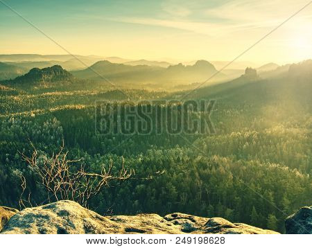 Beautiful Misty Sunrise In Toned Picture . Autumn Hilly Landscape Covered With Shinning Fog.  Sharp 