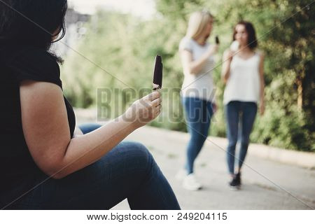 Excessive Weight, Overeating, Obesity, Bad Habits And Lifestyle. Overweight Woman Envy To Fit Girls 