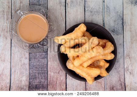 Ready Served Of A Cup Of Coffee And Patongko (deep-fried Dough Stick)
