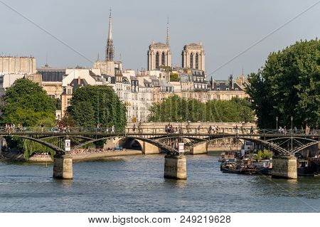 Paris, France - 24 June 2018: View Of Pont Des Arts, Ile De La Cité, And Notre-dame Cathedral.
