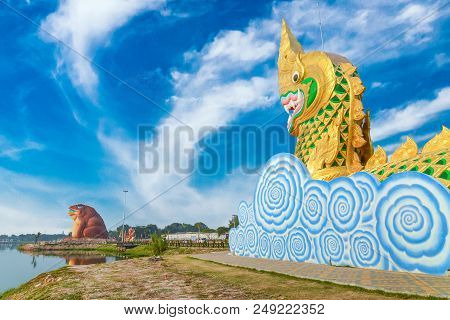 Yasothon, Thailand - February 22, 2016 : Statue Of Naga And Phaya Kan Kark (or Toad King) In Yasotho