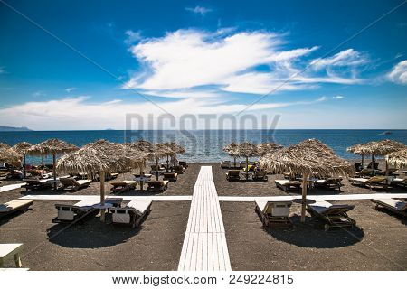 Permissa black sand beach in Santorini. Greece. 