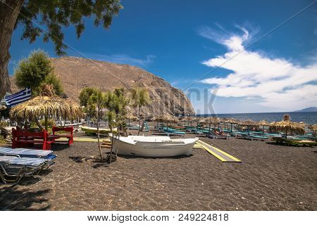 Permissa black sand beach in Santorini. Greece. 