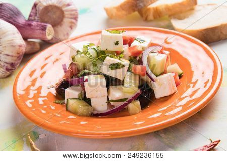 Greek salad with feta cheese cubes and fresk vegetables