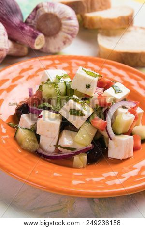 Greek salad with feta cheese cubes and fresk vegetables