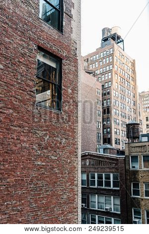New York City, Usa - June 20, 2018: Cityscape Of Manhattan With Old Buildings And Water Towers Again