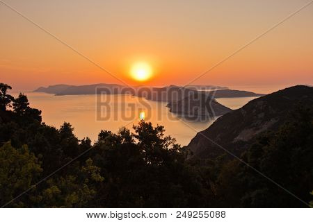 Aerial Sunrise Behind Alonisos Island From The Top Of A Hill In Skopelos, Greece
