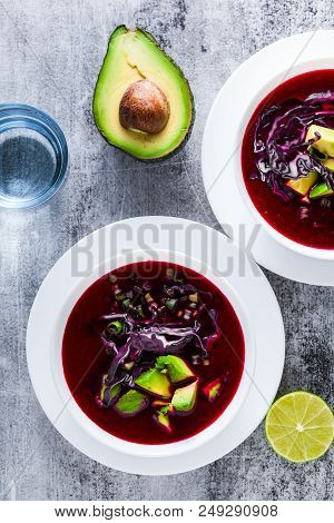 Beetroot Gazpacho Soup With Blue Cabbage, Avocado And Green Onio