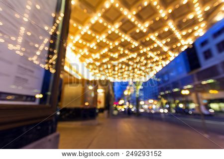 Portland Oregon Downtown Entertainment And Shopping District At Evening Blue Hour With Marquee And T