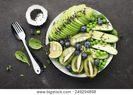 Green Fruit Vegetables Summer Detox Bowl Of Salad. Avocado, Spinach, Cucumber, Micro Greens, Blueber
