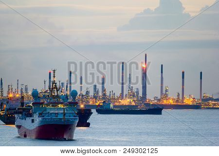 Seismic Survey Vessel And Cargo Container Ships Off The Coast Of Singapore Island Petroleum Chemical