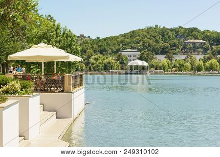 Russia, Krasnodar Region, Novorossiysk, Abrau-durso - June 12, 2018: People Sit In A Summer Cafe On 