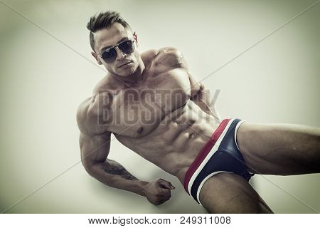 Attractive Young Man Laying On The Floor With Naked Muscular Ripped Body