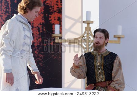 ST. PETERSBURG, RUSSIA - JULY 12, 2018: Yevgeny Chernyadiev as Sobakin (right) and Ilya Selivanov as Lykov in the opera The Tsar's Bride outdoors during the festival All Together Opera