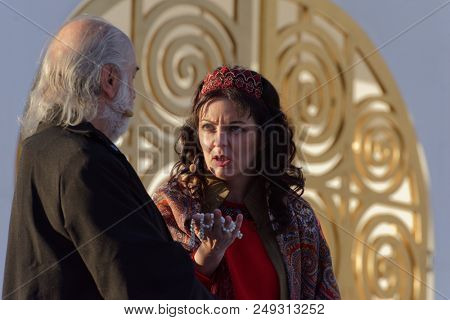 ST. PETERSBURG, RUSSIA - JULY 12, 2018: Natalia Yevstafieva as Lyubasha (right) and Nikolai Gassiev as Bomely in the opera The Tsar's Bride outdoors during the festival All Together Opera