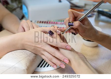 Painting Nails In Nail Salon, Uv Lap Of Quick Dry Nail Polish Manicure, Focus On Brush