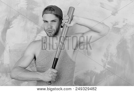 Sports And Baseball Training Concept. Guy In Grey Tank Top Holds Bright Green Bat. Player With Confi