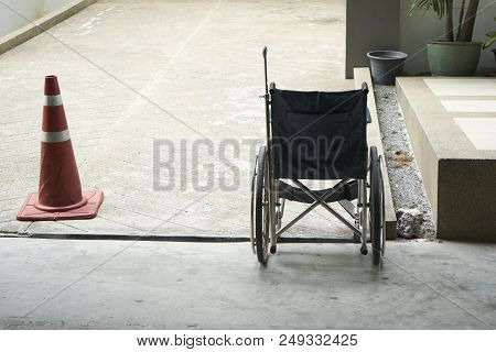 A Blue Wheelchair Parking In The Buildin