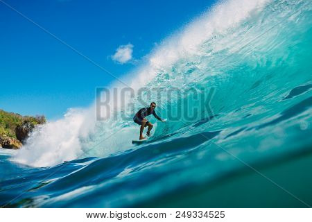 July 7, 2018. Bali, Indonesia. Surfer Ride On Big Barrel Wave At Padang Padang. Professional Surfing