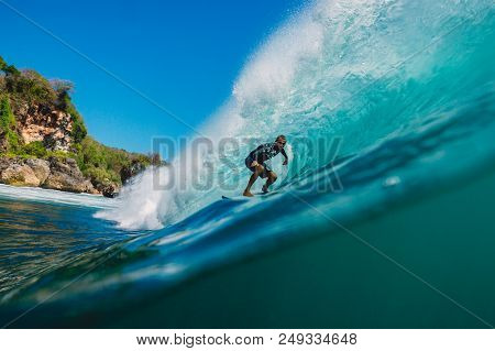 July 7, 2018. Bali, Indonesia. Surfer Ride On Big Barrel Wave At Padang Padang. Professional Surfing