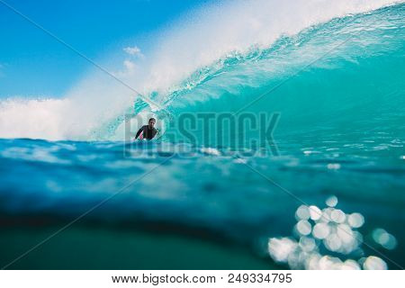 July 7, 2018. Bali, Indonesia. Bodysurfer Ride On Big Barrel Wave At Padang Padang. Professional Sur