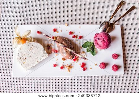 Piece Of Brown Mousse A U Chocolate Sweet Dessert And Decoration On A White Plate Background