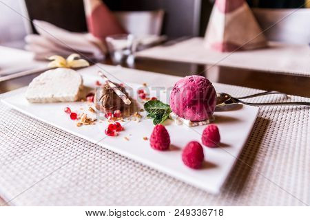 Piece Of Brown Mousse A U Chocolate Sweet Dessert And Decoration On A White Plate Background