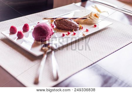 Piece Of Brown Mousse A U Chocolate Sweet Dessert And Decoration On A White Plate Background