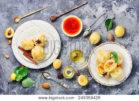 Dumplings With Apricot And Syrup