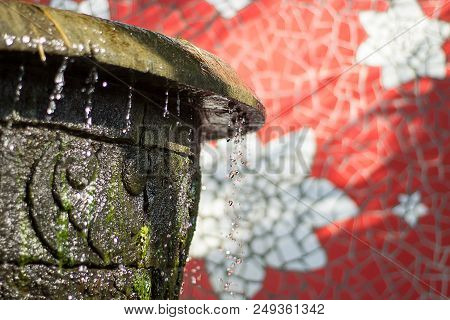 Flowing Splashing Close Up Water Fountain With Sunlight