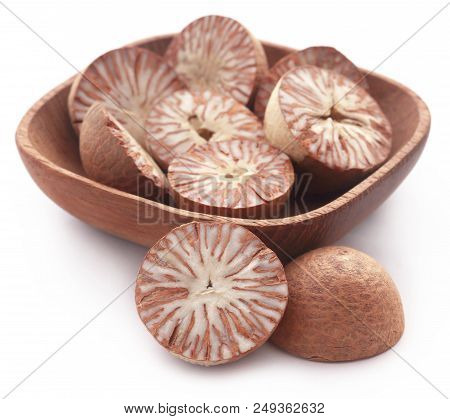 Betel Nuts In A Bowl Over White Background