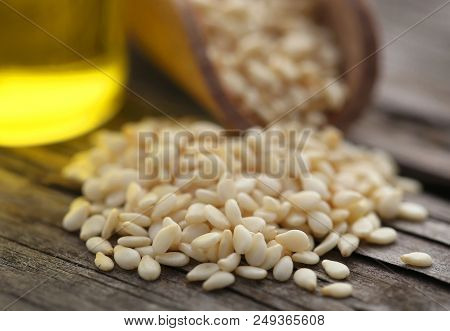 Peeled Sesame Seeds With Oil On Natural Surface